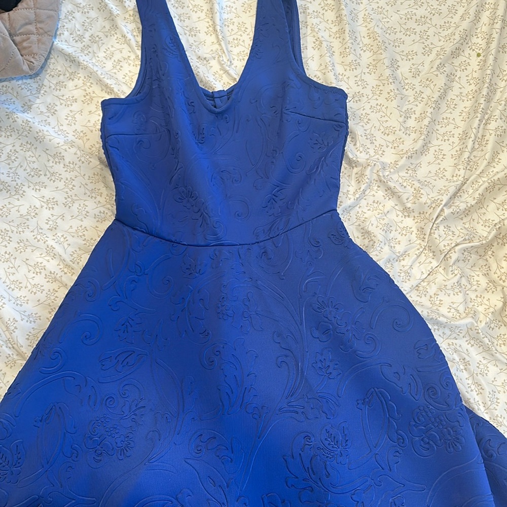 Blue dress with pretty patterns and exposed back